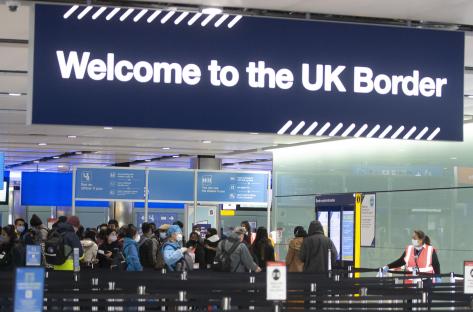 Net migration HALVES from record high to 431,000 – but Keir Starmer is warned numbers are STILL far too high