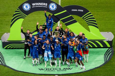 Chelsea FC team celebrating their UEFA Conference League victory.