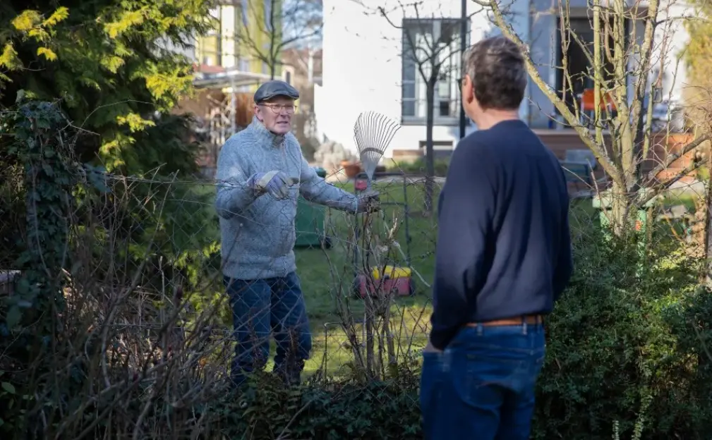 Photo-illustration-neighbors-standing-garden-831668569-1