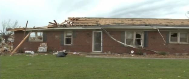 House damaged by tornado; couple hospitalized.