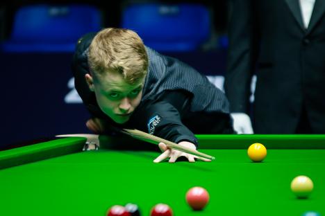 Stan Moody of England playing snooker.