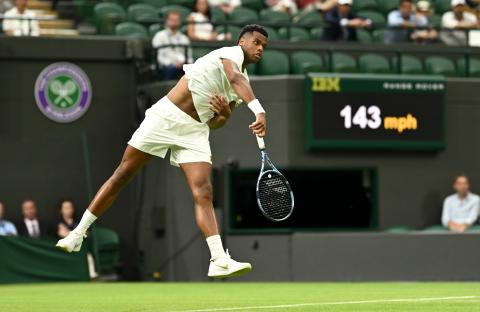 Giovanni Mpetshi Perricard of France serving at Wimbledon.