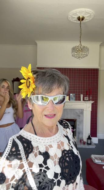 85-year-old woman modeling her granddaughter's clothes.