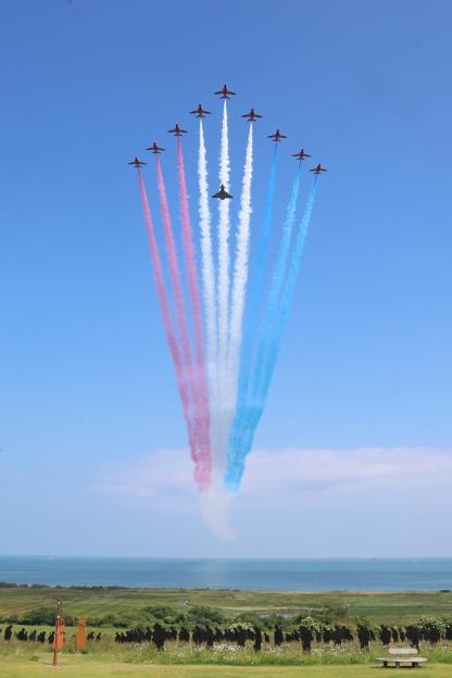 The Red Arrows and a Eurofighter Typhoon flypast the British Normandy Memorial.
