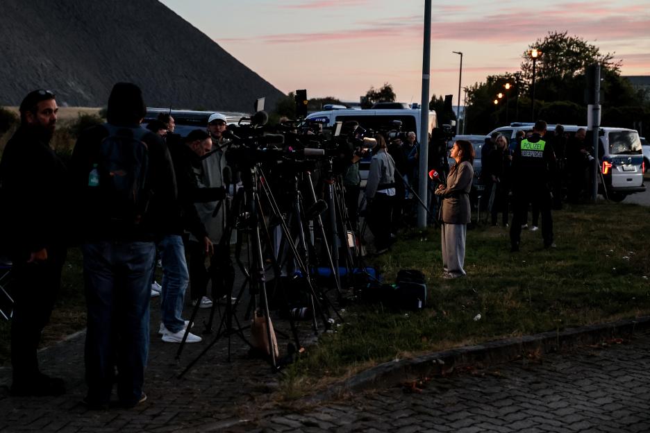 Journalists and police await a prisoner's release outside a high-security prison in Sehnde, Germany.