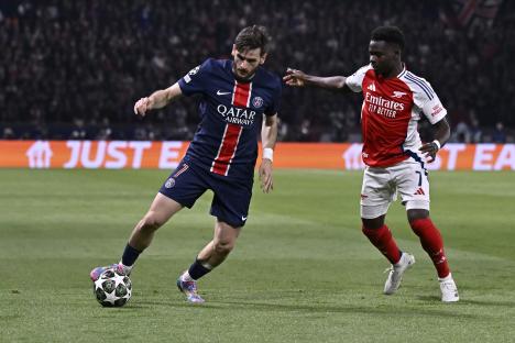 Soccer players competing for the ball.