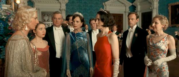 Screenshot from the Downton Abbey trailer showing a group of people in formal wear at a ball.