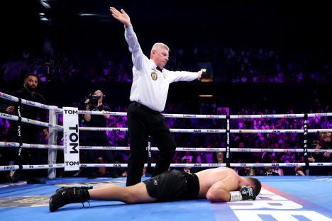 Boxer Johnny Fisher knocked out in a boxing match.