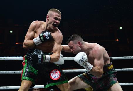 Boxers Josh Taylor and Ivan Baranchyk in a boxing match.