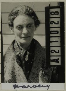 Black and white mugshot of a woman.