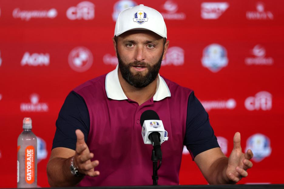 Jon Rahm speaking at a press conference.
