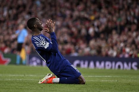 Ousmane Dembele of Paris Saint-Germain reacting during a Champions League match.