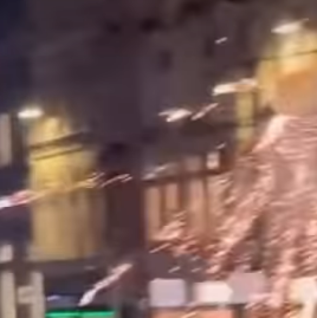 Bright light and sparks illuminating a dark space.