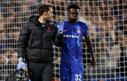 Chelsea's Tyrique George receiving medical attention.