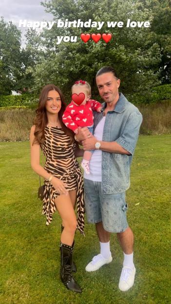 Jack Grealish's girlfriend and daughter with him in a birthday photo.