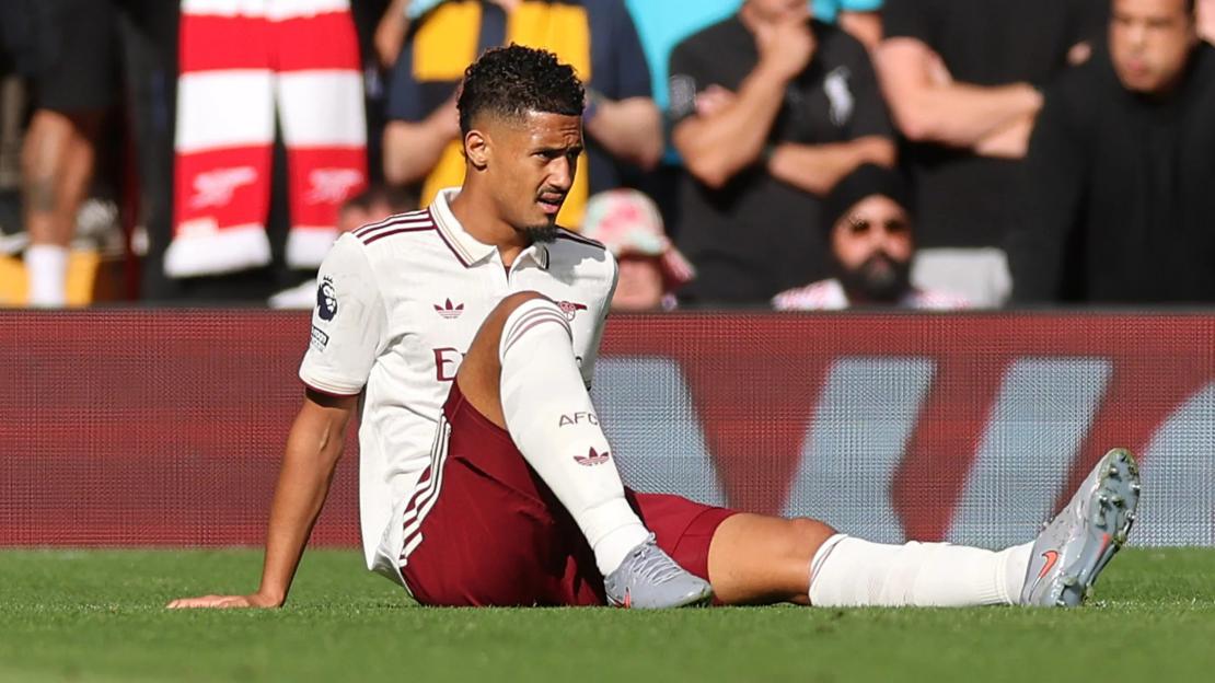 ‘Just end the season already’ – Arsenal fans in meltdown as William Saliba injured just 4 minutes into Liverpool clash