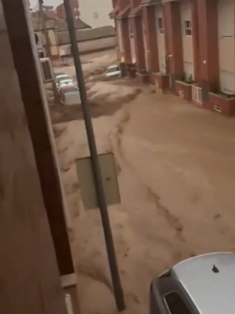 Spain hit by horror floods as deluge leaves drivers trapped and streets underwater… and red alert issued for MORE rain