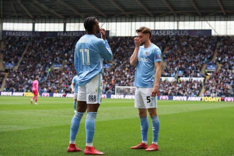 Jack Rudoni and Haji Wright of Coventry City on the field after a goal.