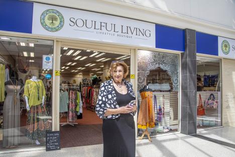 76-year-old Kay Holland standing outside her Soulful Living shop.