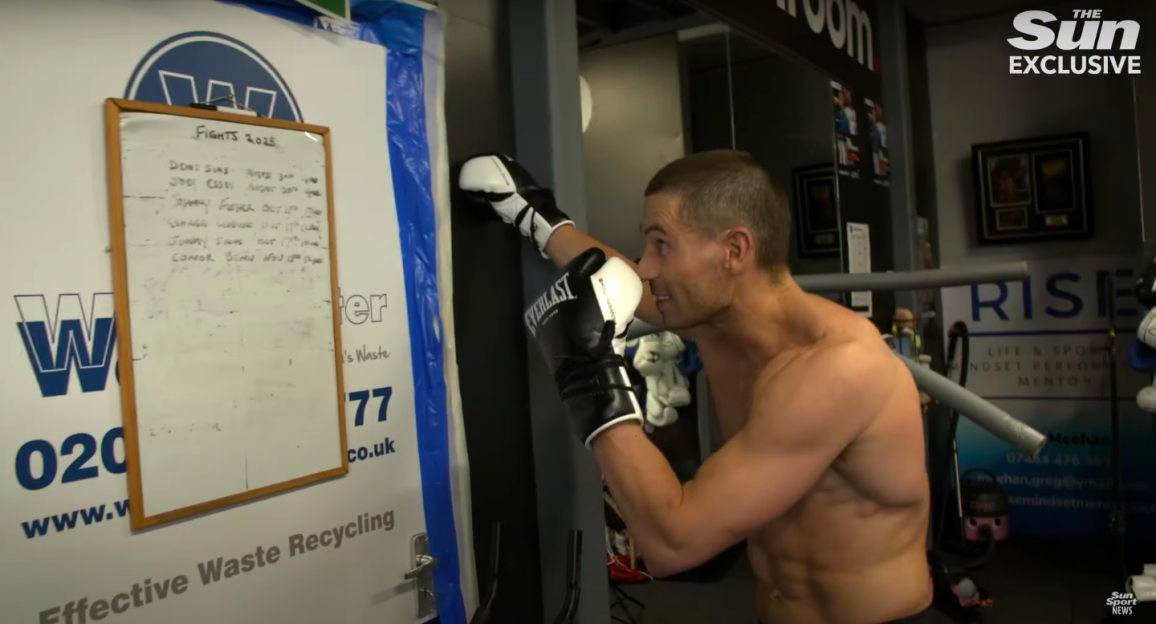Boxer hitting a punching bag.