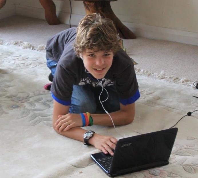 Photo of Breck Bednar using a laptop.