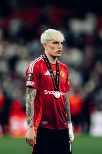 Alejandro Garnacho of Manchester United wearing a medal after a match.