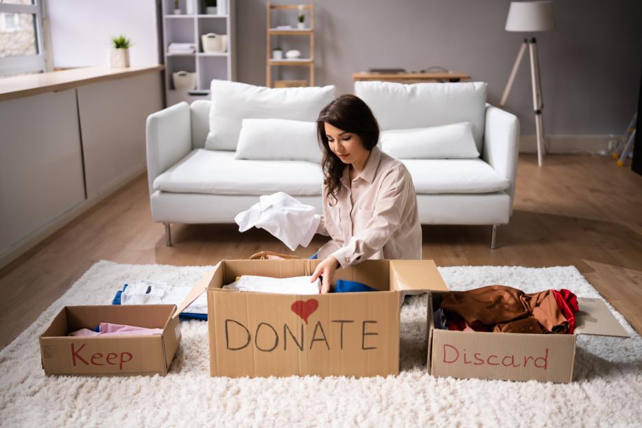 Woman donating clothes.