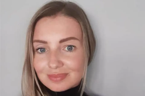 Headshot of a woman with blonde hair.