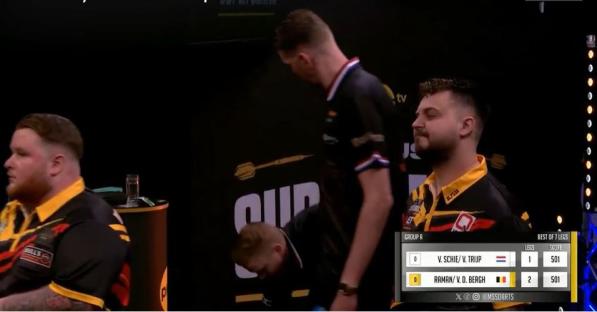 Darts players reacting to a fall.