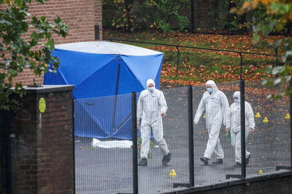 Members of a forensic team work outside the Manchester synagogue, where multiple people were killed on Yom Kippur in what police have declared a terrorist incident, in north Manchester, Britain.