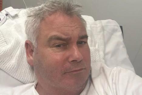 Eamonn Holmes issues update from hospital bed after ambulance dash as he says ‘life isn’t easy these days’