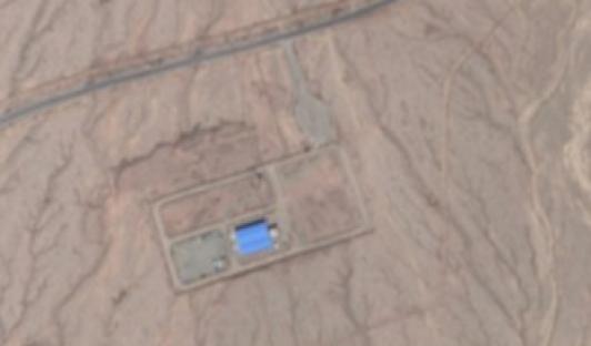 Aerial view of a desert compound.