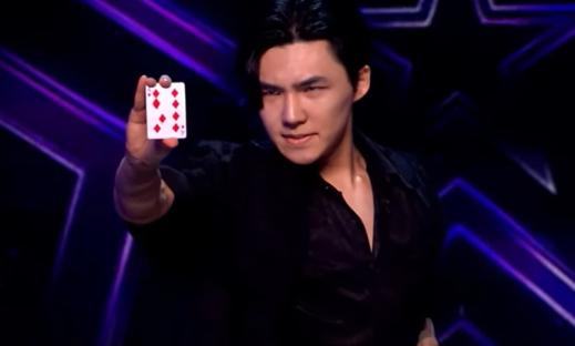 Magician showing a card on Britain's Got Talent.