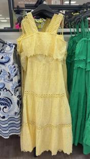 Yellow eyelet maxi dress on display.