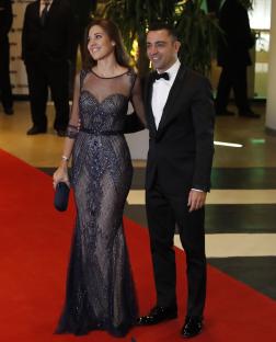 Xavi Hernandez and his wife Nuria Cunillera arriving at a wedding.