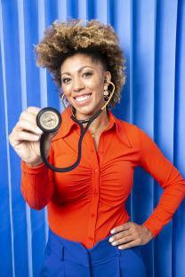 Dr. Zoe holding a stethoscope.