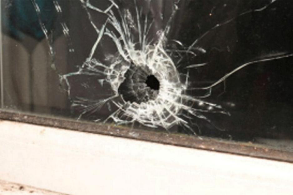 Bullet hole in a window.