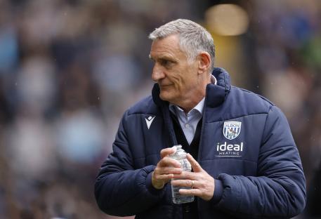 Tony Mowbray, West Bromwich Albion manager, holding a water bottle.