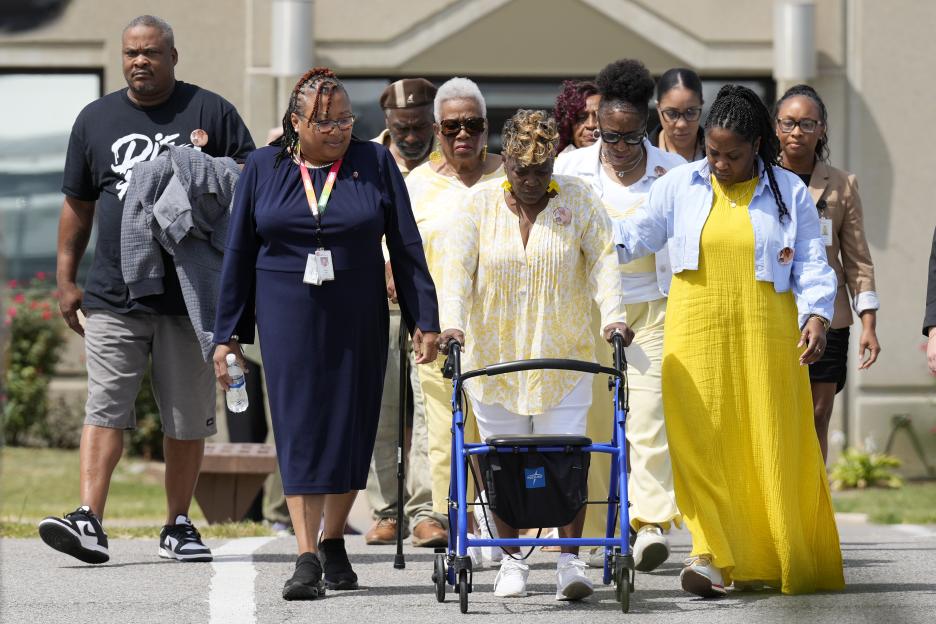Relatives of victims leaving a maximum security institution after an execution.