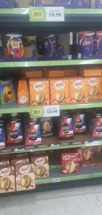 Easter eggs and chocolate bars on a store shelf.