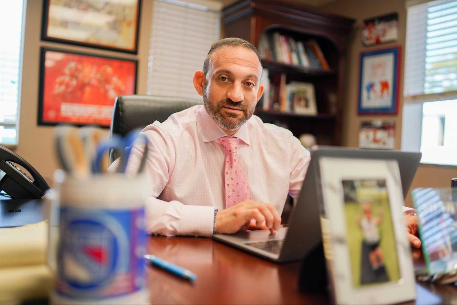 Matthew Dolman, lawyer, working on laptop.