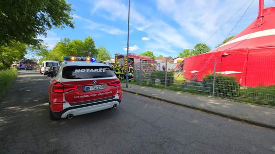 Emergency vehicles at a circus tent.