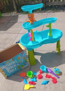 Waterfall beach table with accessories.