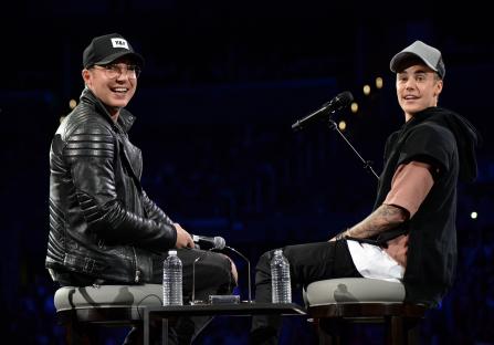 Pastor Judah Smith and Justin Bieber onstage at an event.