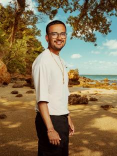 Man standing on a beach.