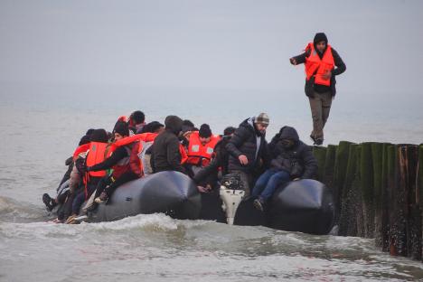 Migrants in an inflatable dinghy attempting to cross the English Channel.