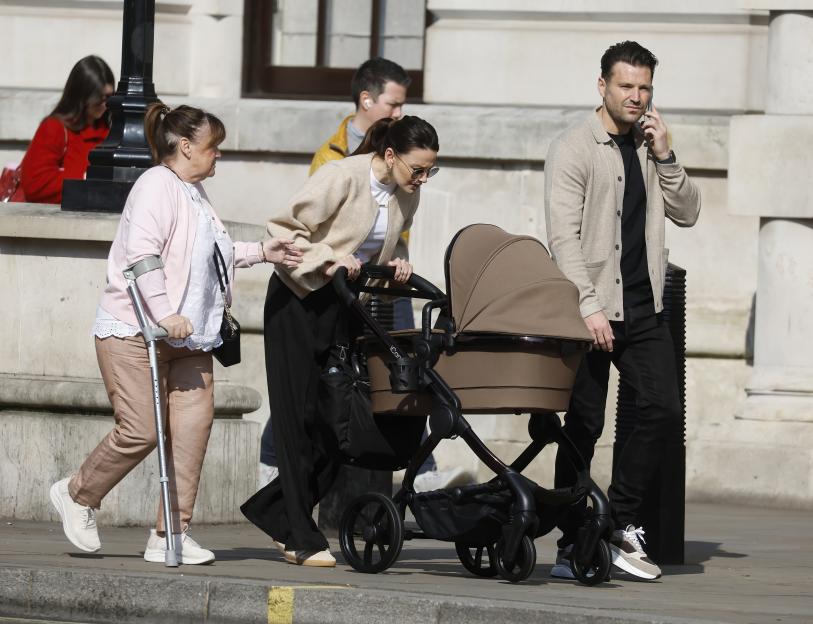Mark Wright and Michelle Keegan pushing a baby stroller with Michelle's mother.