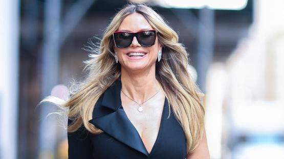 Heidi Klum suffers embarrassing wardrobe malfunction in very high slit dress on a windy NYC day