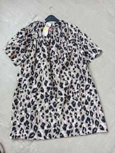 Leopard print dress on a hanger.