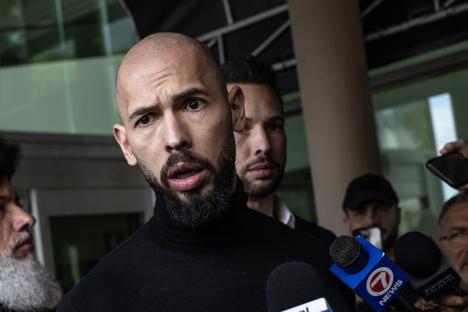 Andrew Tate speaking to reporters.
